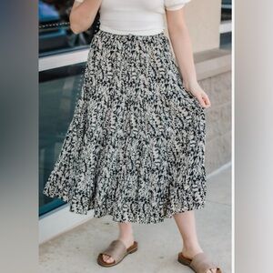 Layered ruffle skirt in a black and white design. Mid calf in length.